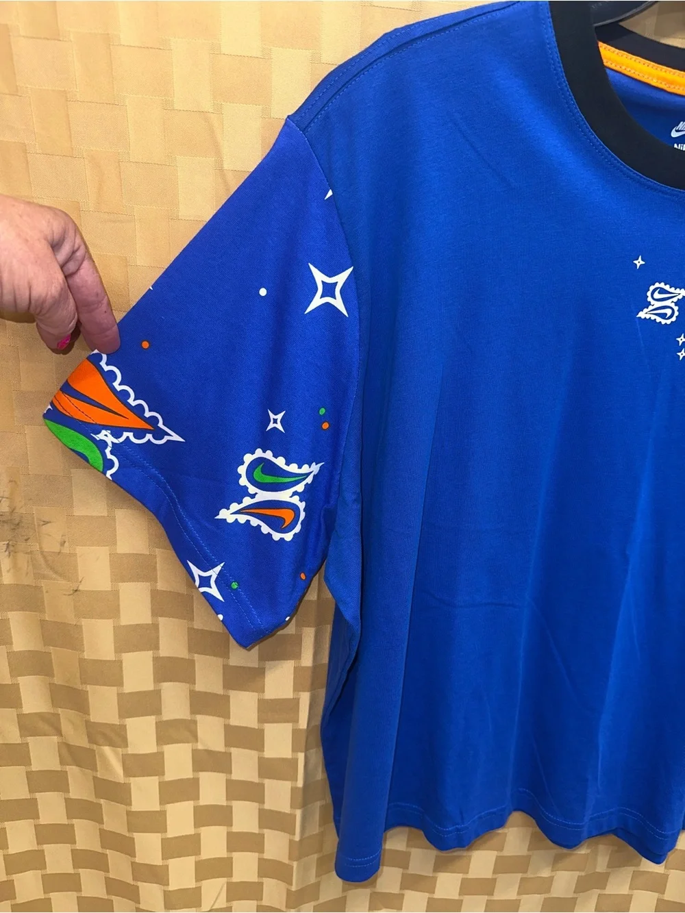 Nike Royal Blue Short-Sleeve Graphic Tee with Orange Accents